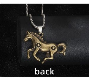 Macro detail of the back view of a vintage bronze galloping horse pendant on a chain