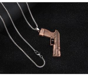 Macro view of bronze-finished revolver pendant necklace with detailed honeycomb texture