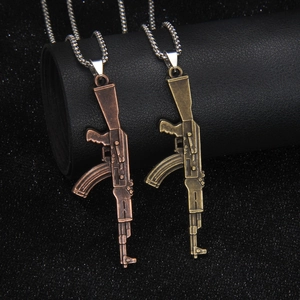Retro vintage revolver and AK-47 rifle pendant necklace in bronze and gold finish
