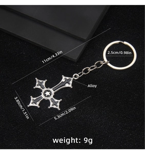 Detailed view of Gothic alloy cross keychain with star pattern and dimensions on black background