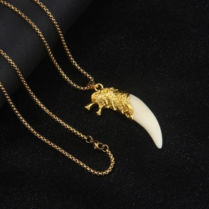 Men's bold golden stainless steel wolf head necklace with acrylic faux fang pendant