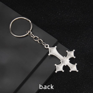 Silver metal cross keychain with radial texture and sturdy round ring for bags