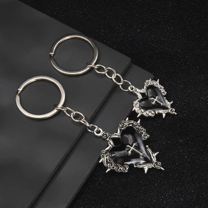 Gothic black heart keychain set with silver cross and rose thorn metallic details