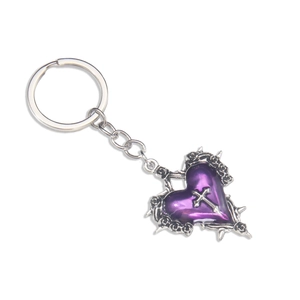 Gothic purple heart keychain with silver cross and thorn detailing on white background