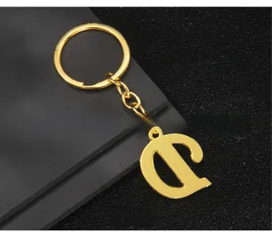 Detailed back view of gold letter D keychain with polished metal link chain and ring