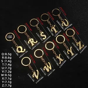 Gold letter keychains set Q to Z with sparkling rhinestones on deep black background