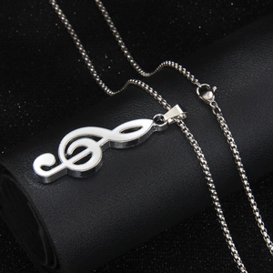 Polished silver stainless steel treble clef music note necklace on black leather roll