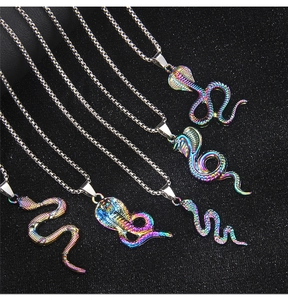 Macro shot of five iridescent rainbow snake pendants on stainless steel chains
