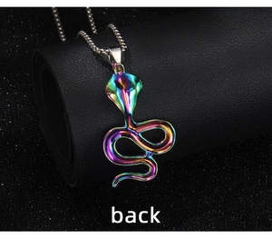 Macro back view of rainbow cobra snake pendant with detailed scales on black leather