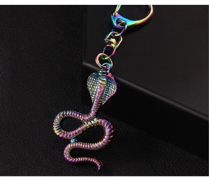 Macro view of a colorful plated cobra snake keychain with vibrant metallic luster