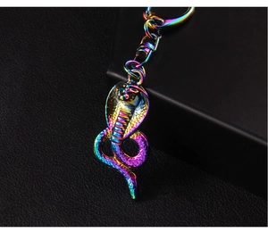 Macro shot of cobra keychain with iridescent plating and detailed scale texture