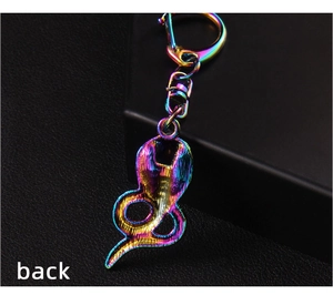 Rear view of rainbow-plated cobra keychain showing smooth metal finish and back texture