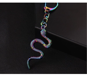 Macro detail of cobra keychain with colorful iridescent plating and scale texture