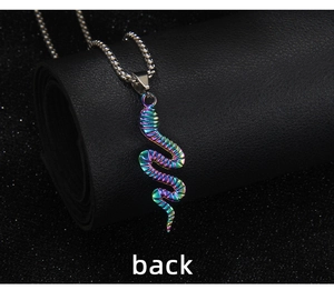 Macro view of the back of a rainbow cobra pendant with a textured stainless steel finish