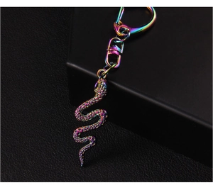 Macro shot of colorful iridescent snake keychain with detailed scale texture and lobster clasp