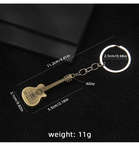 Detailed macro view showing retro bronze guitar keychain dimensions and alloy material texture