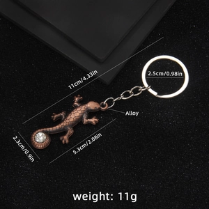 Porte-clés lézard en bronze avec cristal brillant et texture d'écailles fine