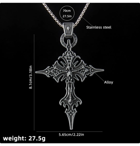 Close-up of gothic cross pendant with skull relief and DIE LAST engraving on ring