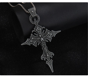 Macro shot of Gothic skull cross pendant with DIE LAST engraving on box chain