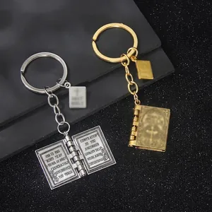 Porte-clés Bible vintage en or et argent avec design croix et finition métal