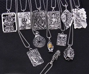 Macro detail of vintage religious relief pendants with oxidized silver finish charms