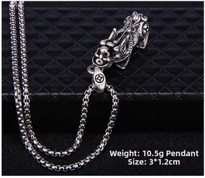 Detailed view of retro Pixiu pendant weighing 10.5g and measuring 3x1.2cm on leather