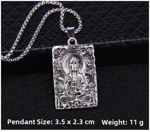Detailed macro view of retro silver Guanyin Buddha pendant with silver round chain necklace