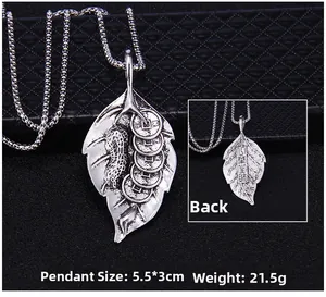 Macro detail of vintage silver leaf pendant showing 5.5x3cm dimensions and weight