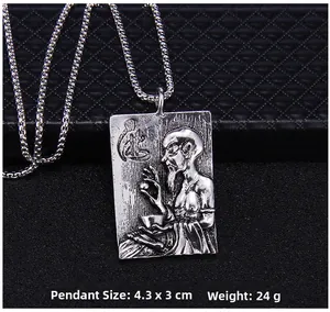 Detailed macro view of a vintage silver rectangular pendant with engraved sage figure
