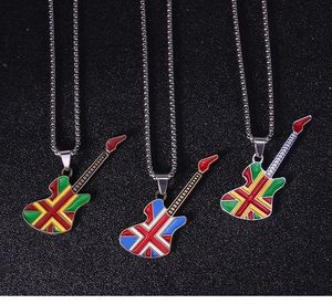 Detailed macro view of three rock-style guitar pendants with British flag and enamel finish