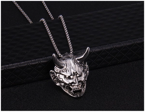 Detailed view of silver Hannya demon pendant with vintage punk style aesthetic