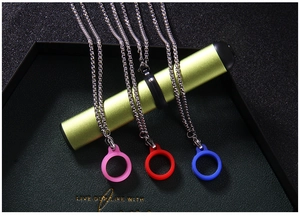 Detail of stainless steel necklace with colorful silicone rings for electronic devices