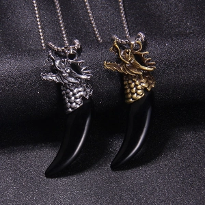 Retro dragon head pendant with wolf tooth charm in silver and bronze finish on bead chain