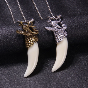 Retro dragon head wolf tooth necklaces in antique bronze and silver metal finishes
