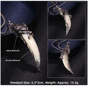 Macro shot of silver wolf head pendant with ivory white tusk and round bead metal chain