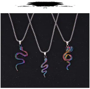 Three rainbow-colored stainless steel snake pendants with intricate scale textures