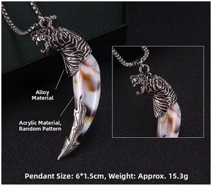 Detailed view of wolf tooth pendant with alloy top and random pattern acrylic body