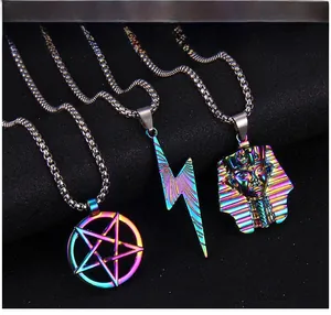 Macro detail of rainbow plated pendants featuring star lightning and pharaoh designs