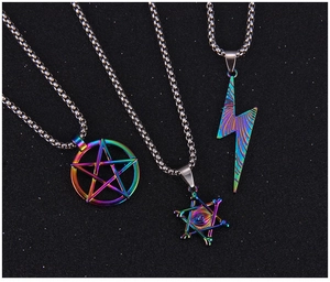 Macro view of rainbow plated pentagram and eye pendants on stainless steel chains