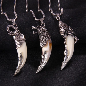 Vintage retro wolf tooth necklace with silver elephant and eagle head pendants
