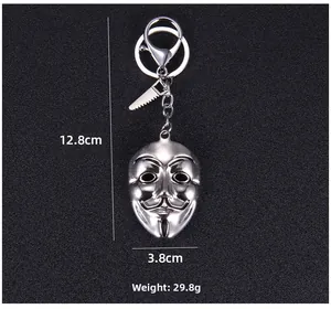Detail showing Guy Fawkes mask keychain dimensions 12.8cm by 3.8cm in silver metal