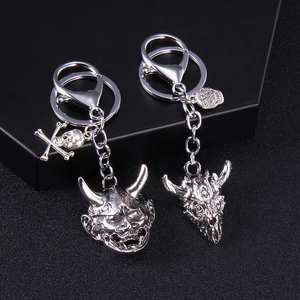 Punk style gothic skull and devil mask keychains in vintage silver finish with relief details