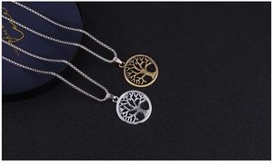 Close-up of tree of life pendants in silver and bronze finishes with hollow design