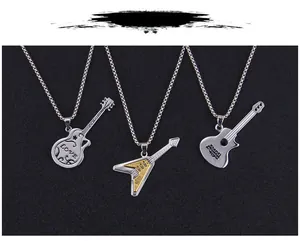 Detailed view of three stainless steel guitar necklaces in silver and gold finishes