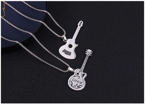 Close-up of guitar-shaped stainless steel pendant with LOVE engraving and floral details
