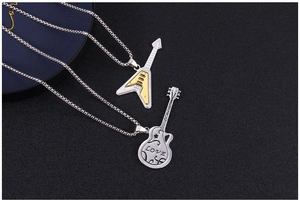 Macro shot of stainless steel guitar pendants featuring LOVE engraving and V-shape electric guitar