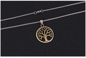 Detailed view of bronze tree of life pendant on a stainless steel silver chain
