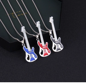 Detailed close-up of retro guitar pendant necklaces with vibrant enamel finish