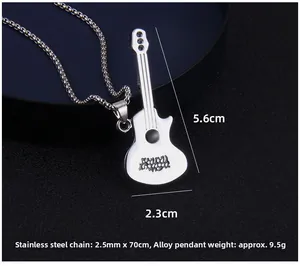 Macro shot of silver guitar pendant with black crystals and stainless steel chain details