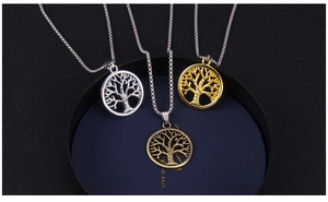 Detailed view of hollow Tree of Life pendants in gold, silver, and bronze finishes
